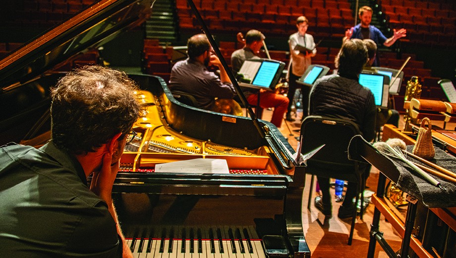 A new music ensemble rehearses in the Logan Center for the Arts.