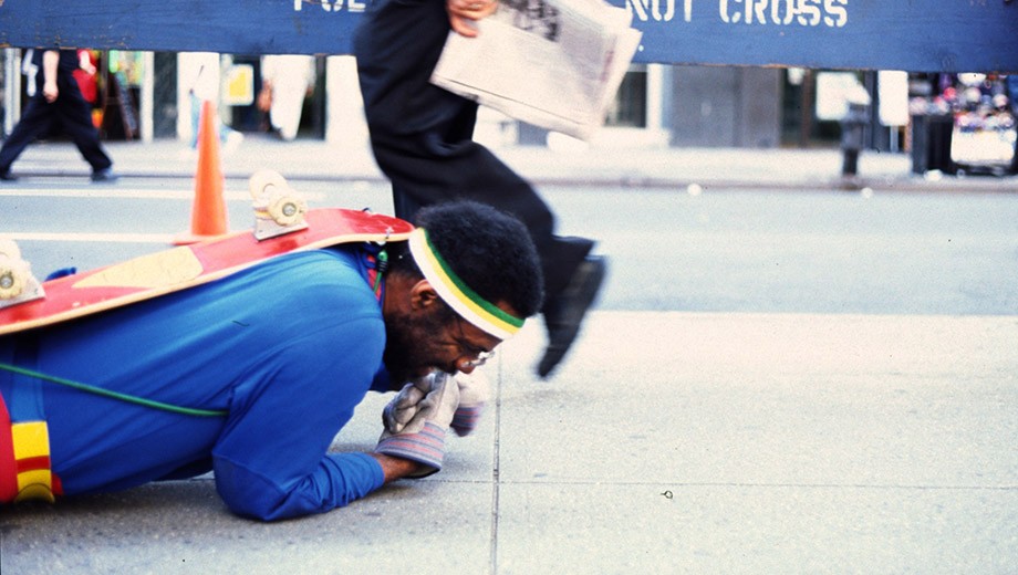 Pope.L crawled along Broadway in New York City in a capeless Superman outfit.